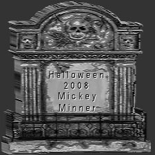 Mickey Minner tombstone with greek columns and skulls in the corner
